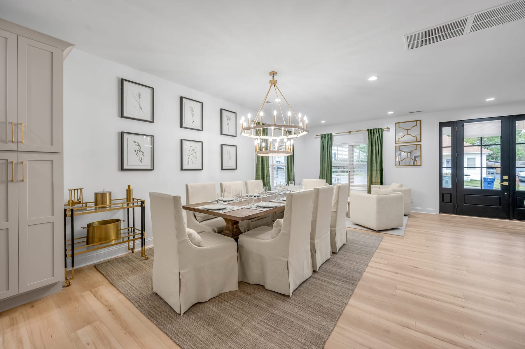 Open dining and living space in a Lexington, Kentucky vacation rental set with a long table and seating for a large group